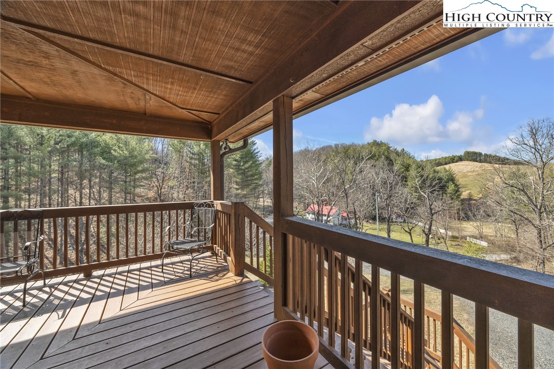 1118 Lucy Bell Road Crumpler, NC 28617 - Photo 31 of 39 a view of balcony with wooden floor & fence