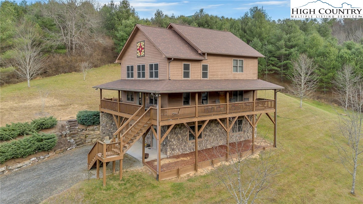 1118 Lucy Bell Road Crumpler, NC 28617 - Photo 32 of 39 an aerial view of a house having yard