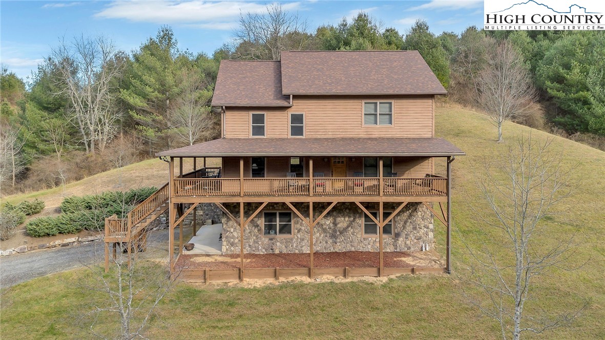 1118 Lucy Bell Road Crumpler, NC 28617 - Photo 34 of 39 a front view of a house with garden