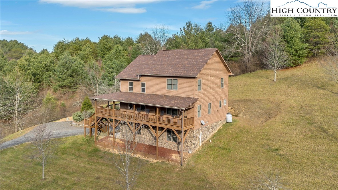 1118 Lucy Bell Road Crumpler, NC 28617 - Photo 36 of 39 a balcony with table and chairs
