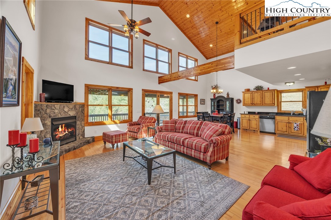 1118 Lucy Bell Road Crumpler, NC 28617 - Photo 4 of 39 a living room with furniture and a flat screen tv