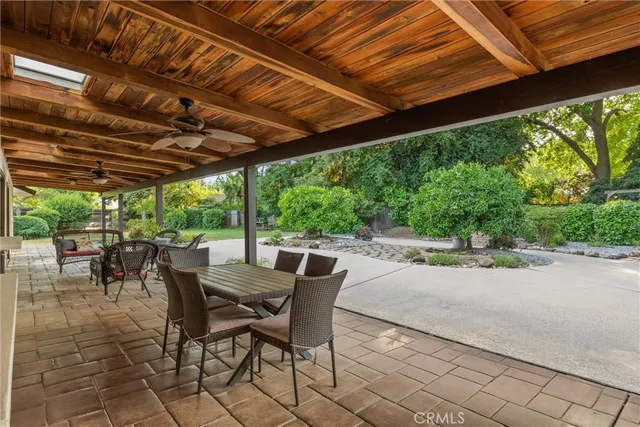 a view of a backyard with wooden fence