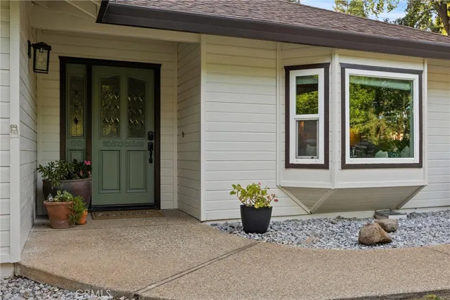 a view of hallway with livingroom and furniture