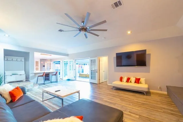 a living room with furniture and a flat screen tv