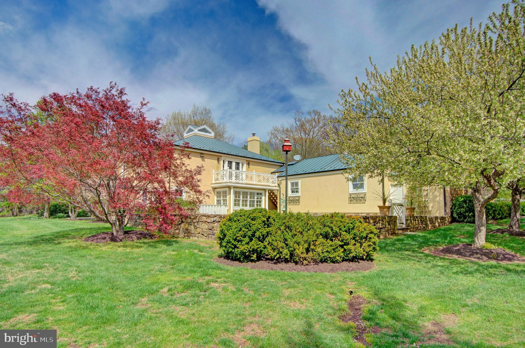 8638 Meadows Road Warrenton, VA 20186 - Photo 8 of 66 Side of the house w/stone wall & secret garden