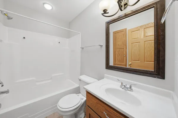 a bathroom with a sink a toilet and a bathtub