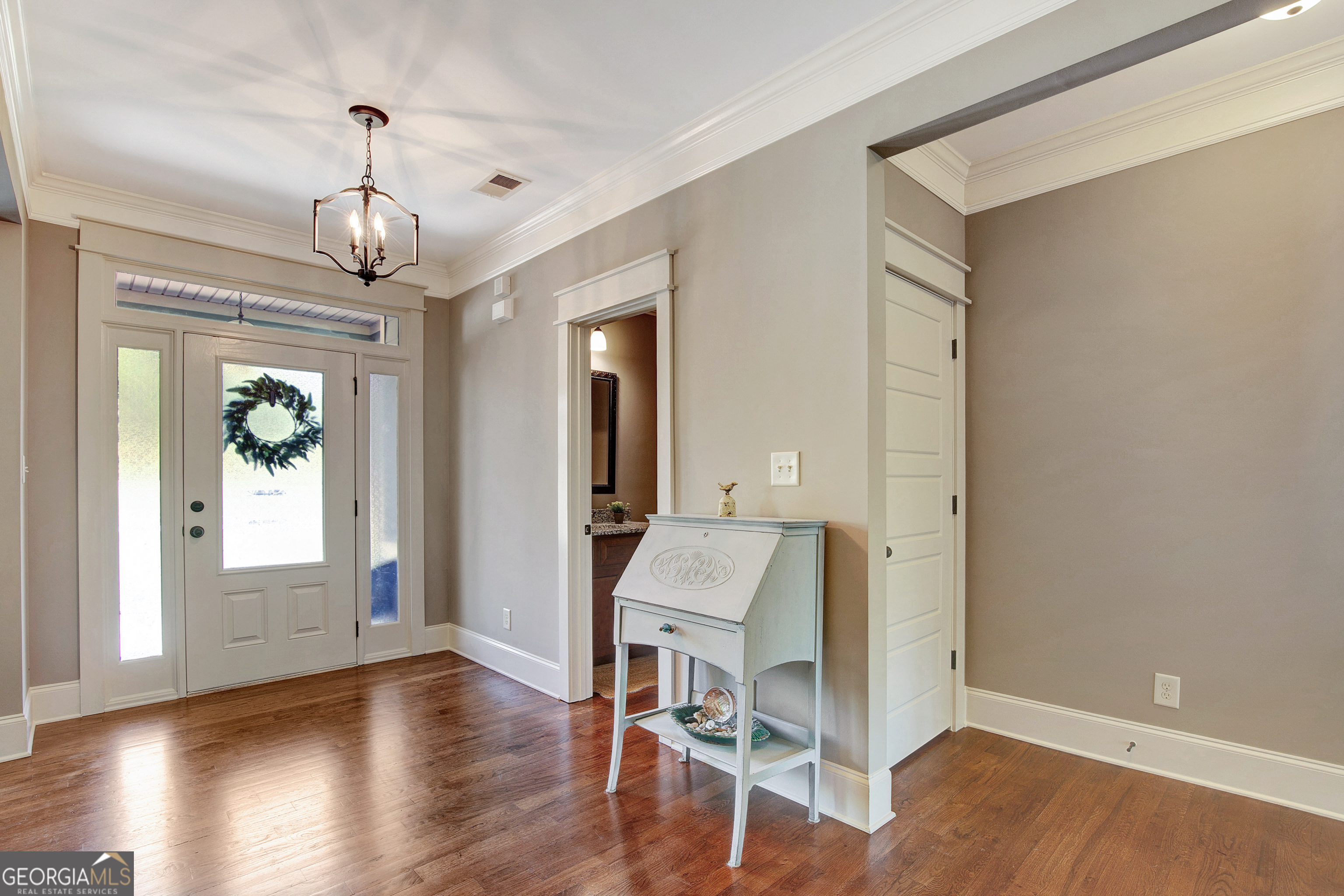 137 Kenmare Row Tyrone, GA 30290 - Photo 62 of 91 a view of a room with wooden floor chandelier and windows