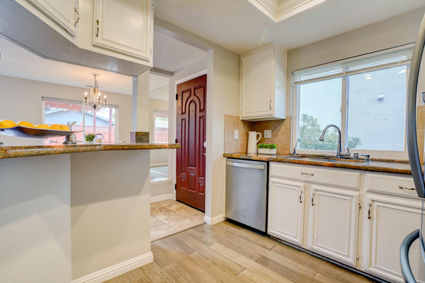 44 Redding Road Campbell, CA 95008 - Photo 12 of 51 a kitchen with stainless steel appliances granite countertop a sink and wooden cabinets