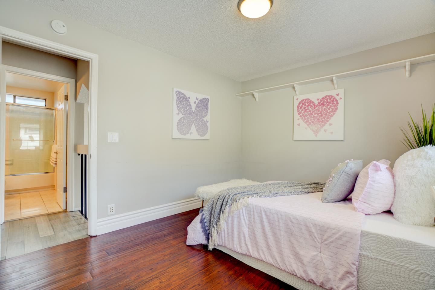 44 Redding Road Campbell, CA 95008 - Photo 32 of 51 a bedroom with a bed and wooden floor