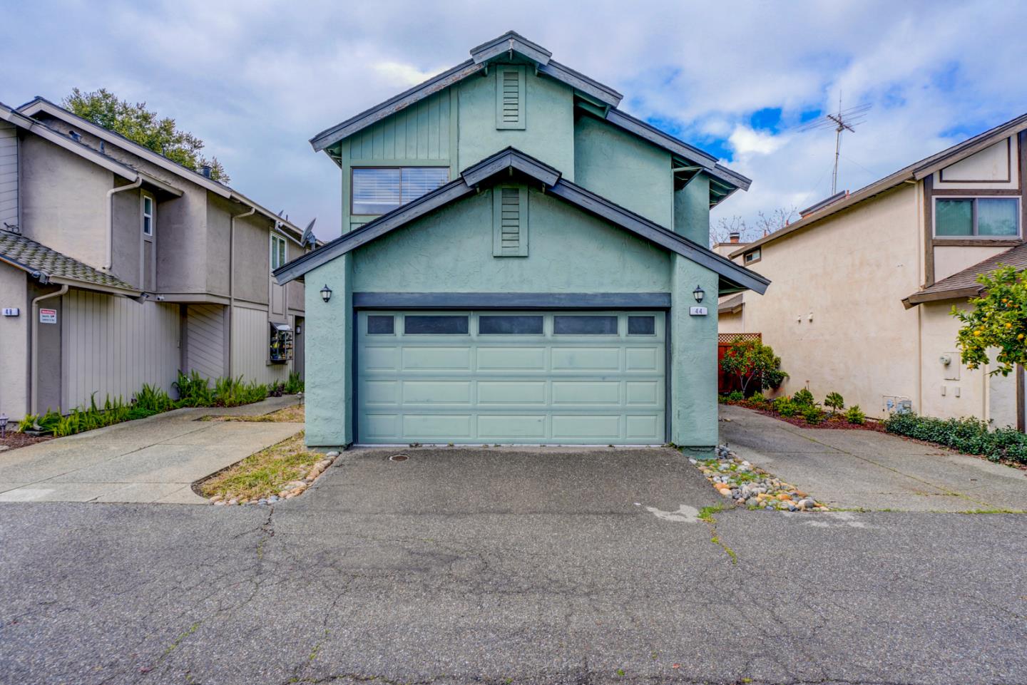 44 Redding Road Campbell, CA 95008 - Photo 45 of 51 a view of a house with a yard and garage