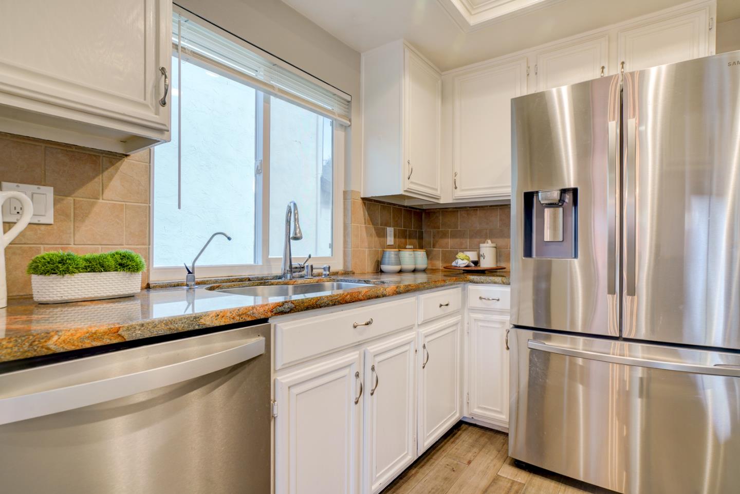 44 Redding Road Campbell, CA 95008 - Photo 9 of 51 a kitchen with white cabinets and refrigerator