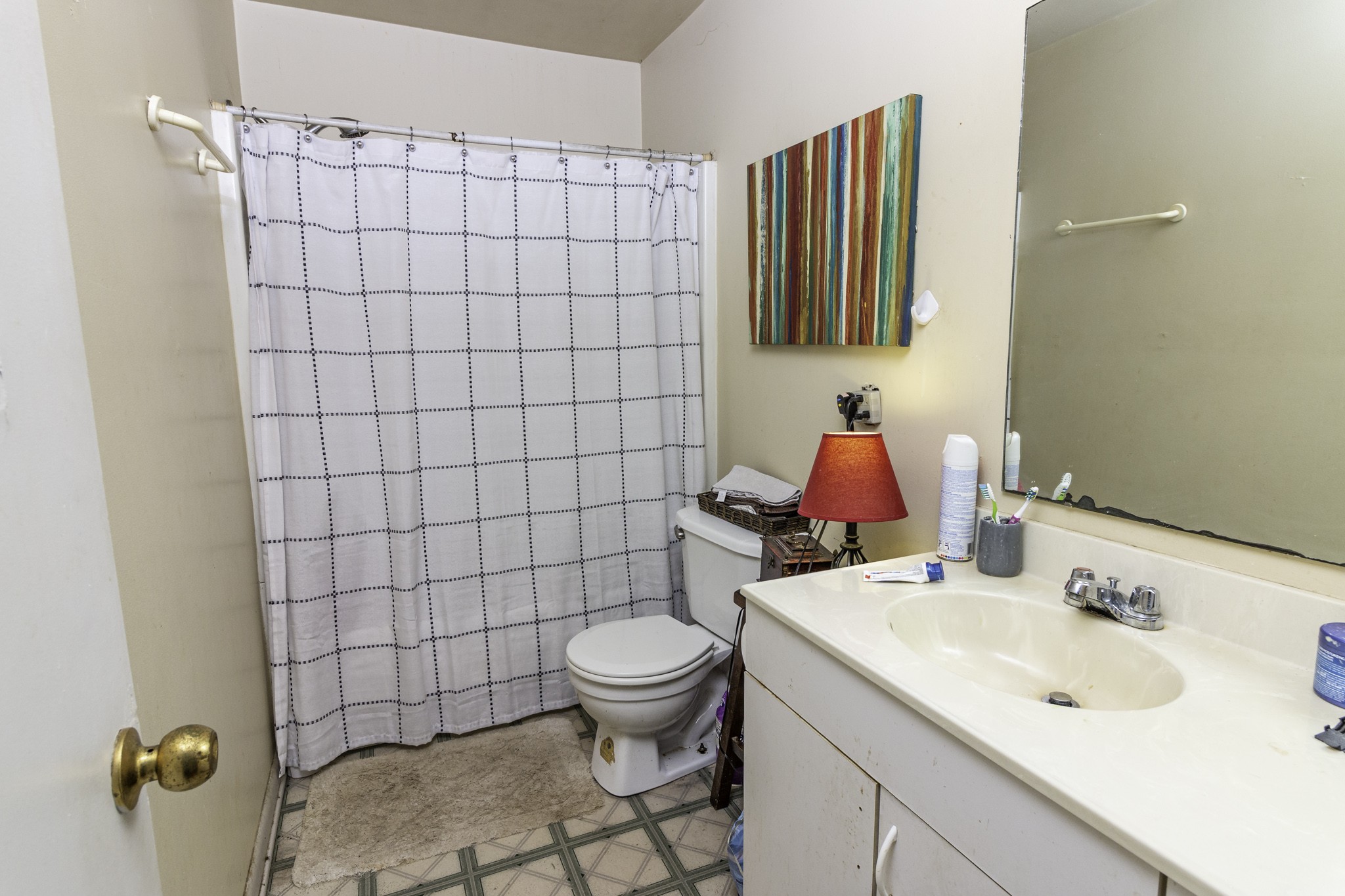 121 Glenn Springs Road Lawrenceburg, TN 38464 - Photo 13 of 17 a bathroom with a sink toilet and shower
