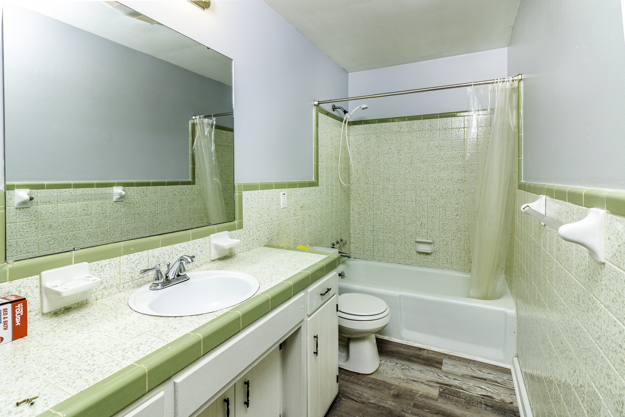 121 Glenn Springs Road Lawrenceburg, TN 38464 - Photo 6 of 17 a bathroom with a granite countertop shower sink vanity mirror and toilet