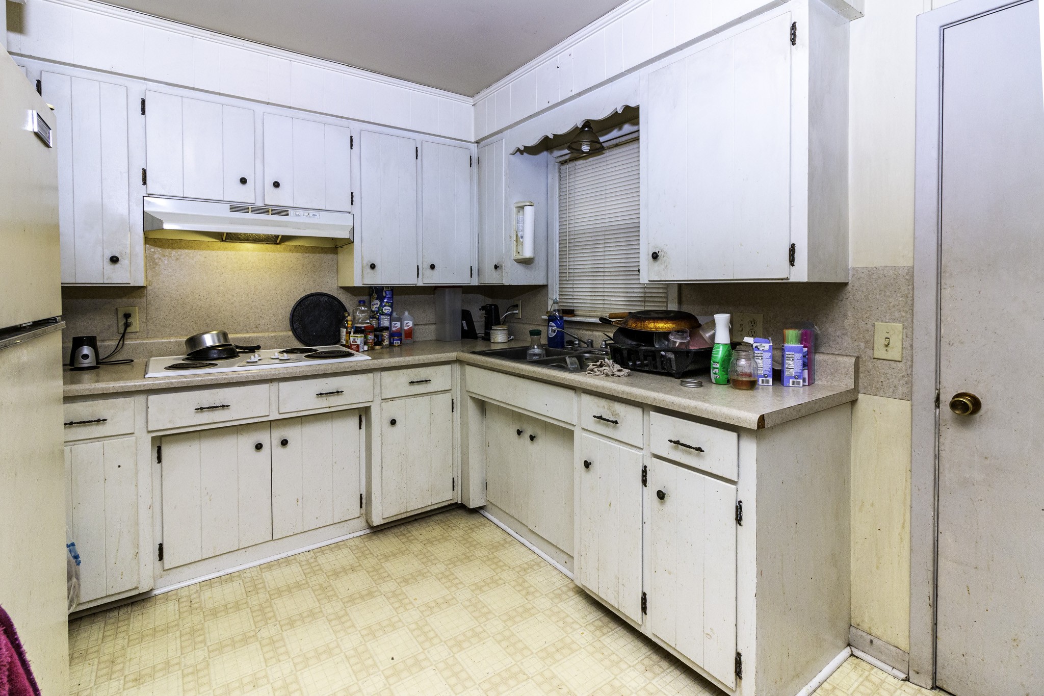 121 Glenn Springs Road Lawrenceburg, TN 38464 - Photo 10 of 17 a kitchen with white cabinets and white appliances