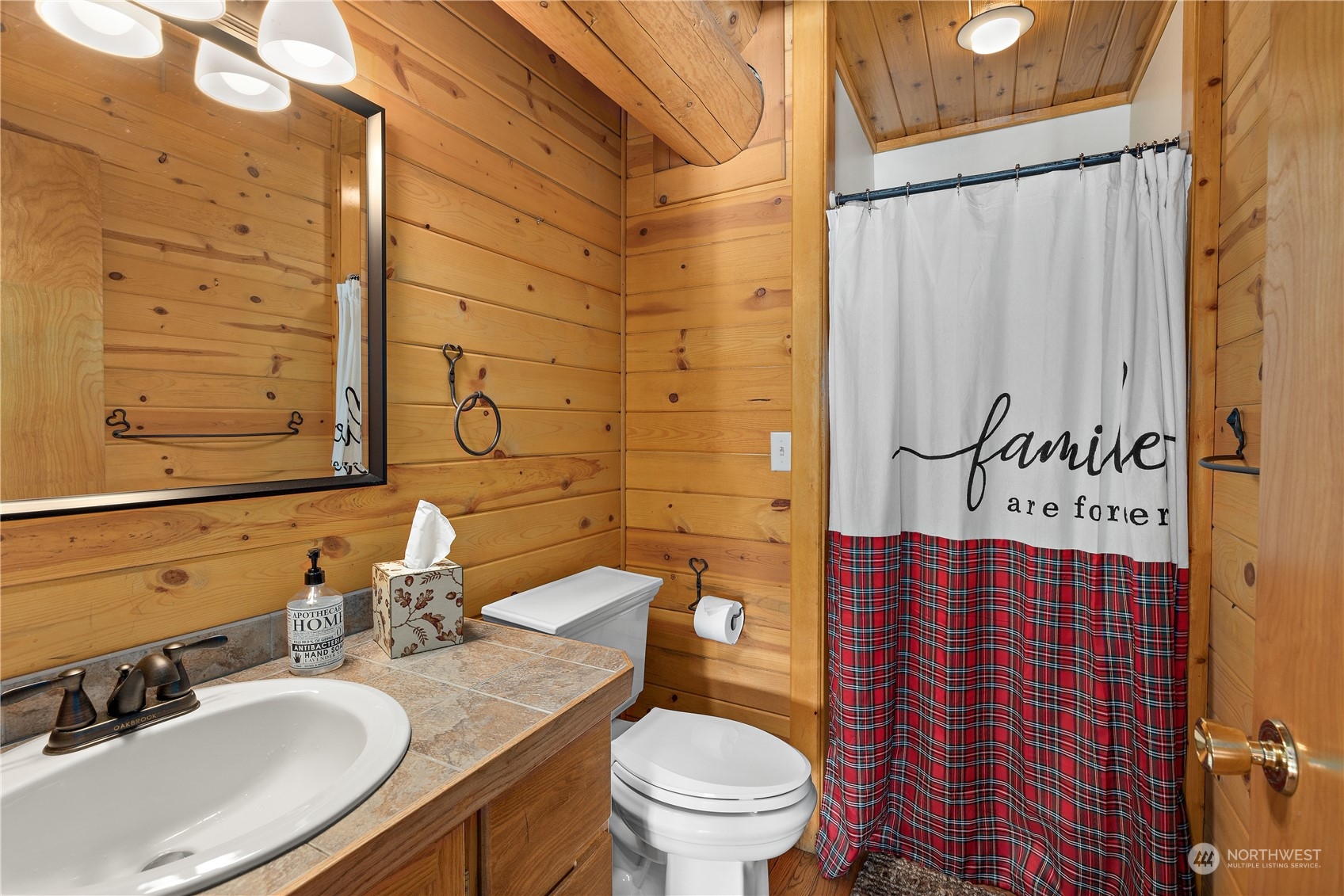 3435 Teanaway Road Cle Elum, WA 98922 - Photo 26 of 33 a bathroom with a granite countertop toilet sink and mirror