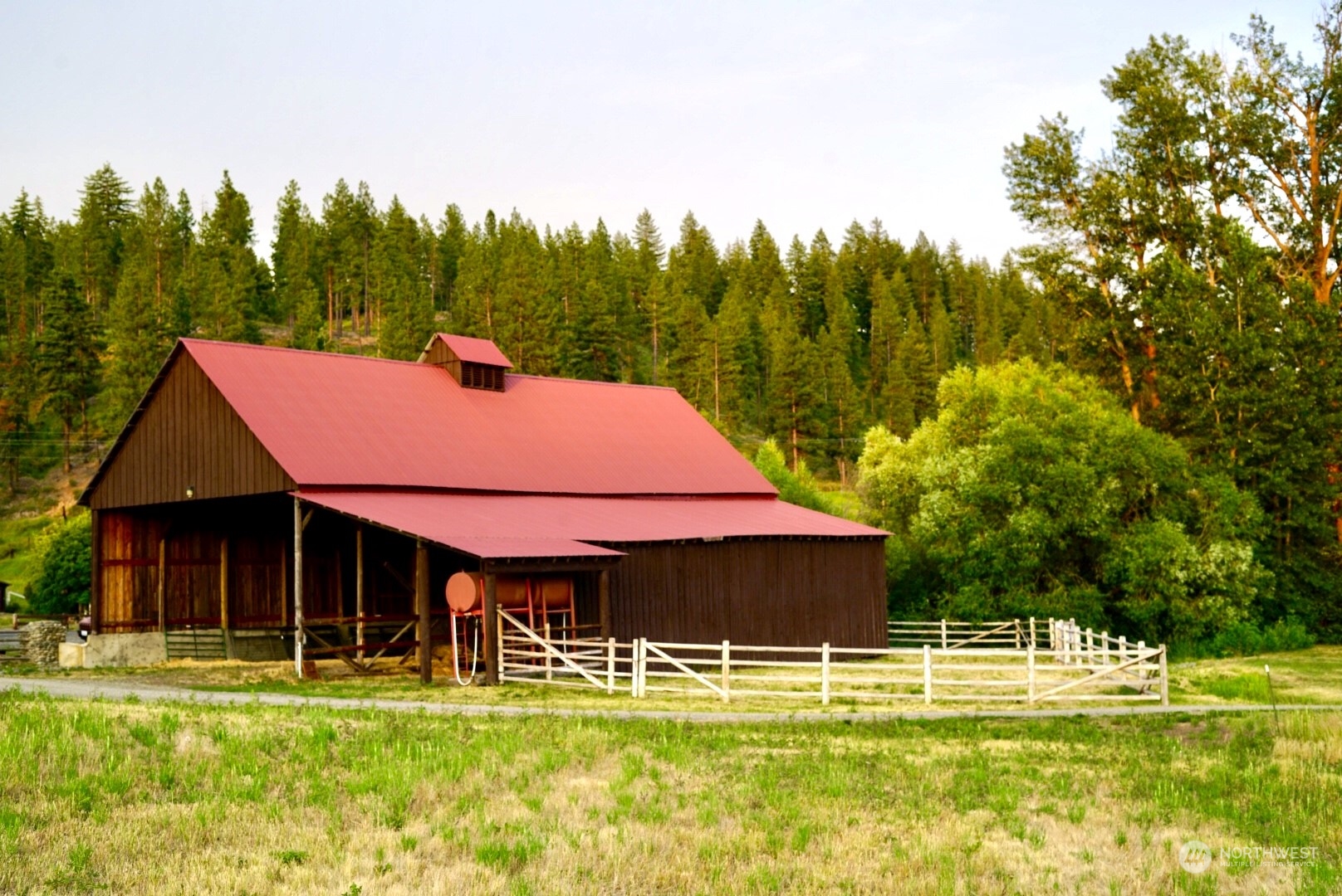 3435 Teanaway Road Cle Elum, WA 98922 - Photo 7 of 33 a view of a swimming pool with a house in the background