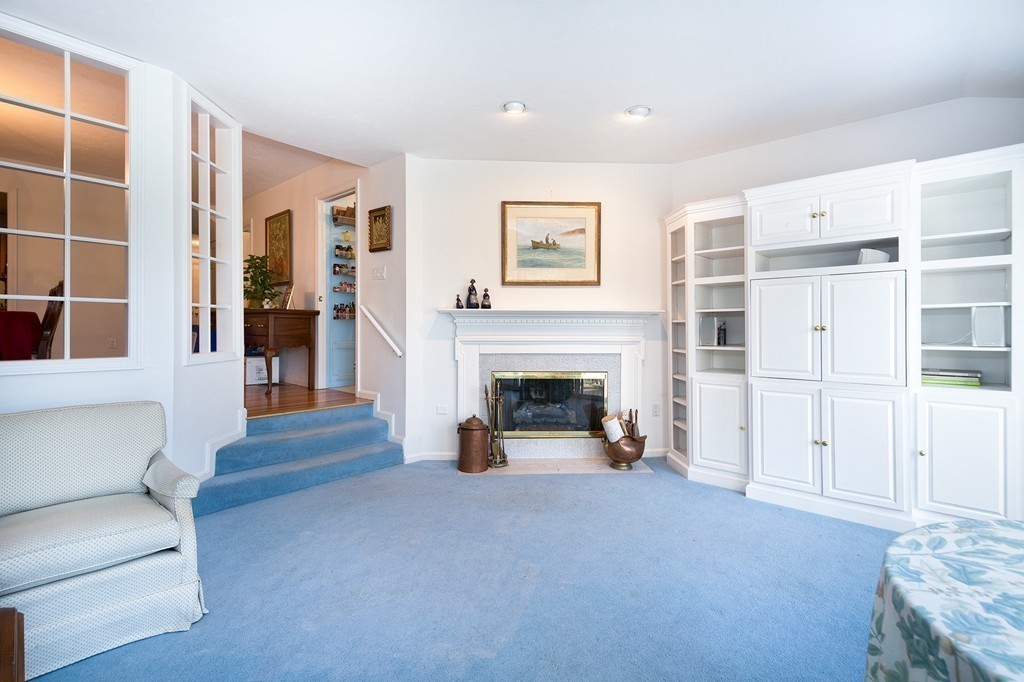 40 Driftway, Unit 13 Scituate, MA 02066 - Photo 11 of 29 a living room with furniture and a fireplace
