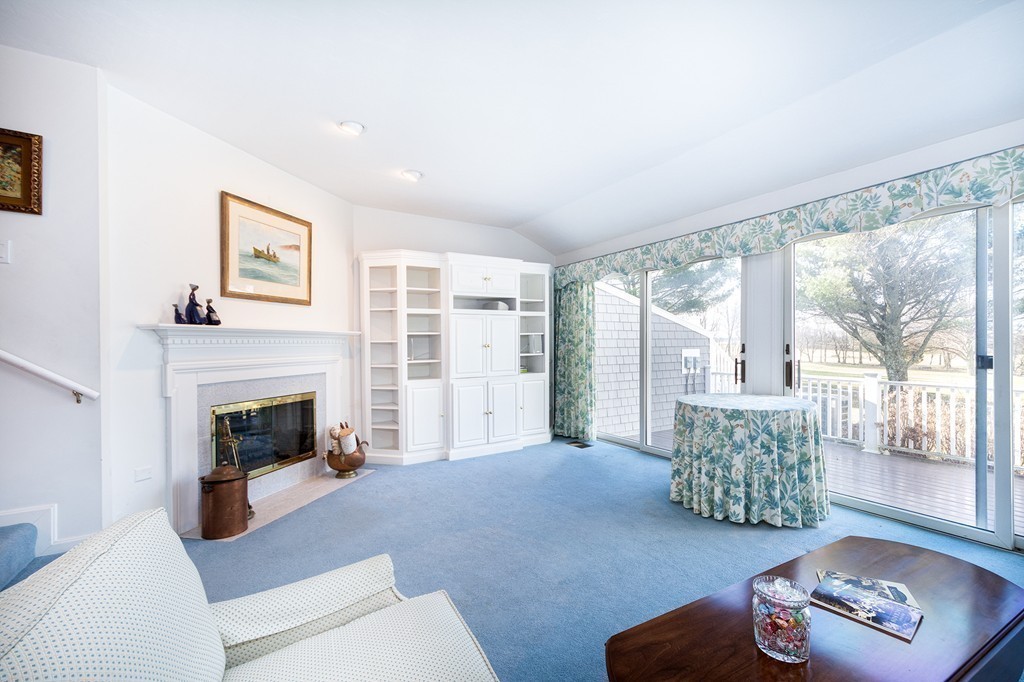 40 Driftway, Unit 13 Scituate, MA 02066 - Photo 12 of 29 a living room with furniture and a fireplace