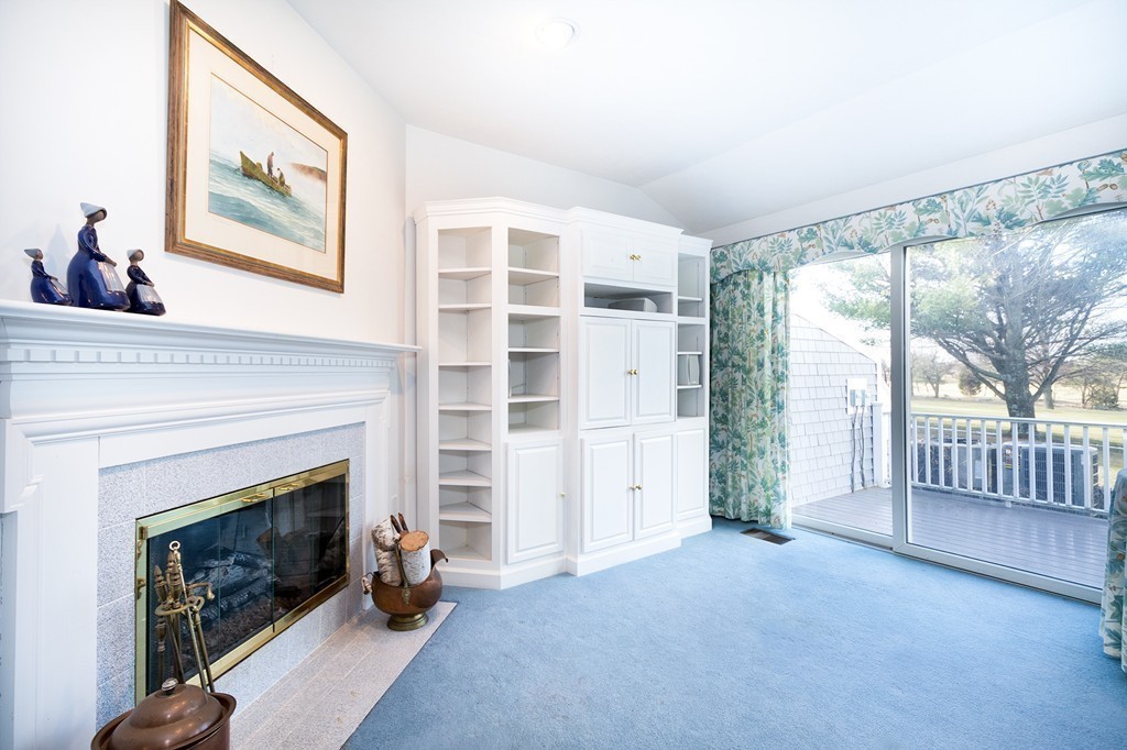 40 Driftway, Unit 13 Scituate, MA 02066 - Photo 13 of 29 a view of a livingroom with furniture and a fireplace