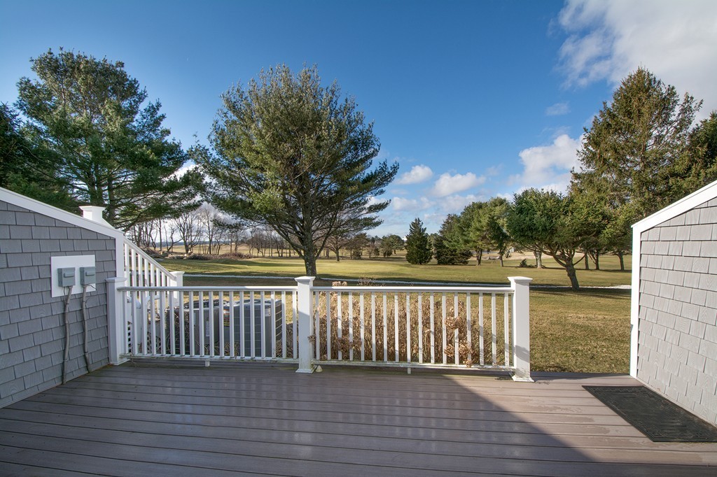 40 Driftway, Unit 13 Scituate, MA 02066 - Photo 14 of 29 a view of deck with large trees and wooden fence