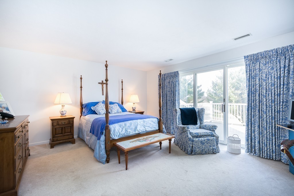 40 Driftway, Unit 13 Scituate, MA 02066 - Photo 17 of 29 a bedroom with furniture and large window