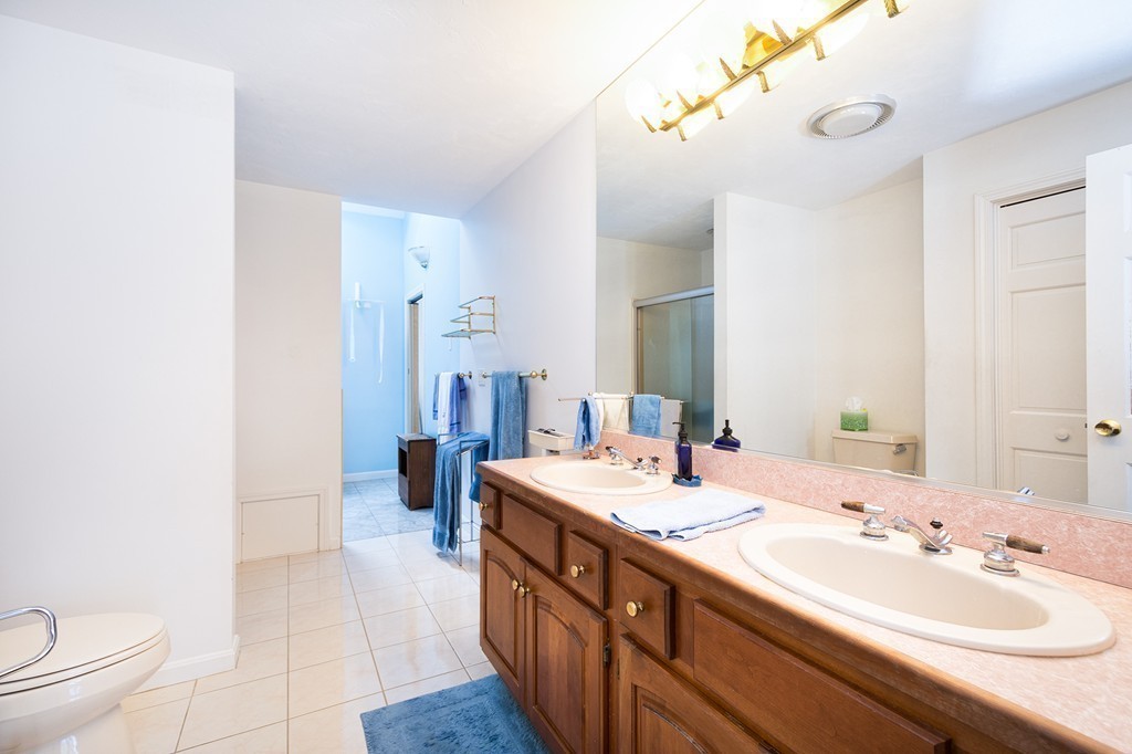 40 Driftway, Unit 13 Scituate, MA 02066 - Photo 19 of 29 a spacious bathroom with a double vanity sink mirror and toilet