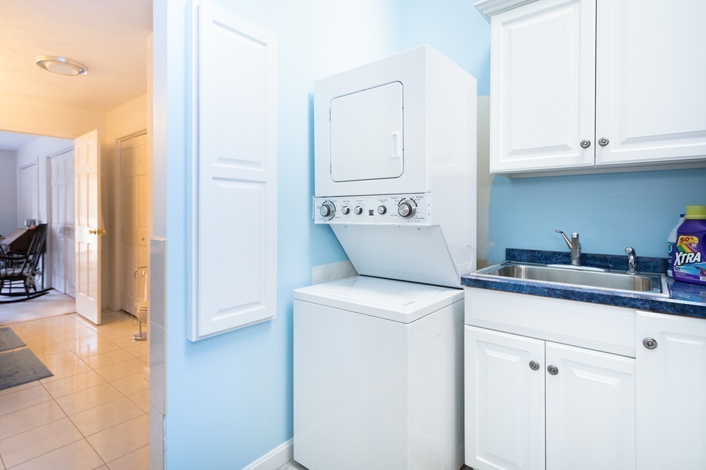 40 Driftway, Unit 13 Scituate, MA 02066 - Photo 21 of 29 a utility room with closet and mirror