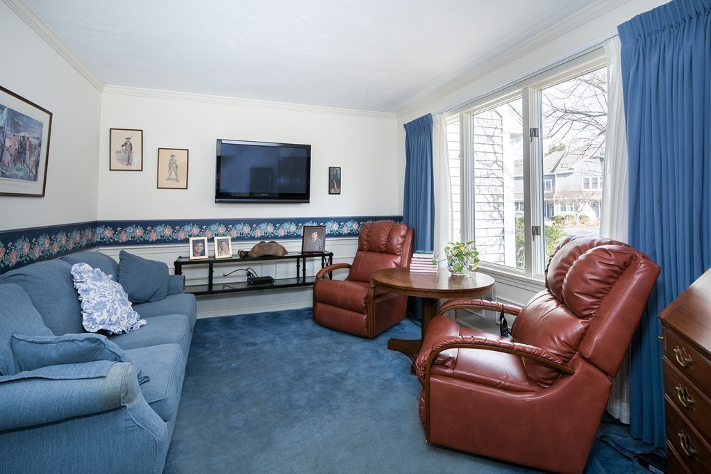 40 Driftway, Unit 13 Scituate, MA 02066 - Photo 5 of 29 a living room with furniture and a flat screen tv