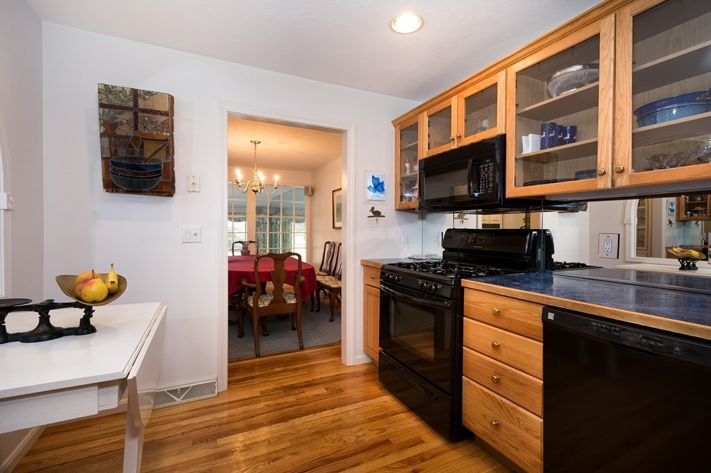 40 Driftway, Unit 13 Scituate, MA 02066 - Photo 7 of 29 a kitchen with stainless steel appliances granite countertop a stove and a sink