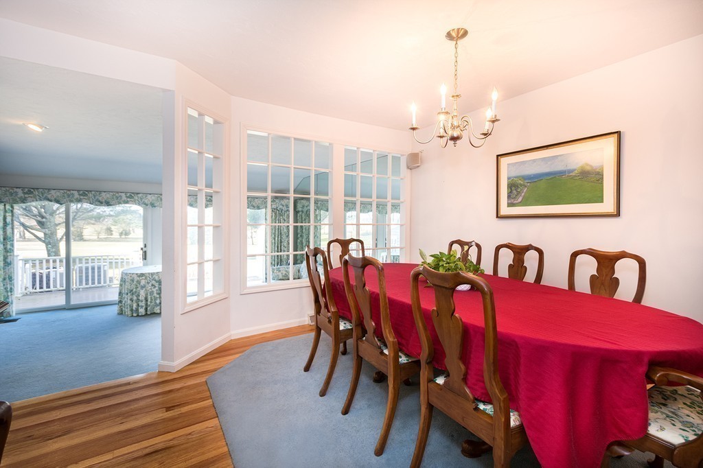 40 Driftway, Unit 13 Scituate, MA 02066 - Photo 9 of 29 a view of a dining room with furniture wooden floor and chandelier