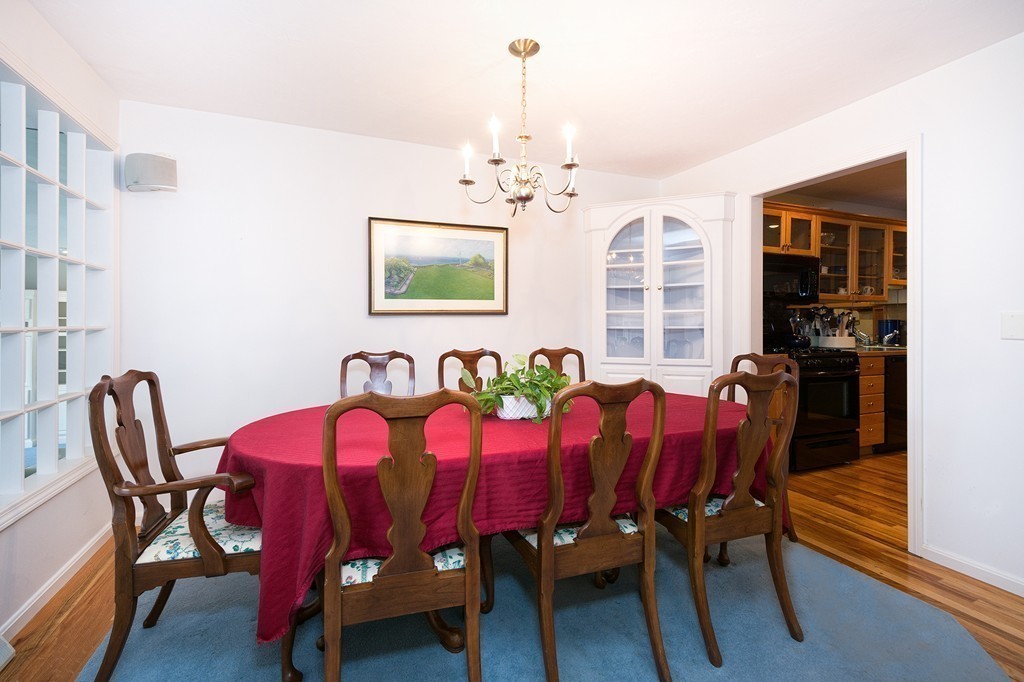 40 Driftway, Unit 13 Scituate, MA 02066 - Photo 10 of 29 a view of a dining room with furniture and chandelier