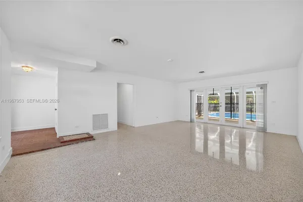 a view of an empty room with a window