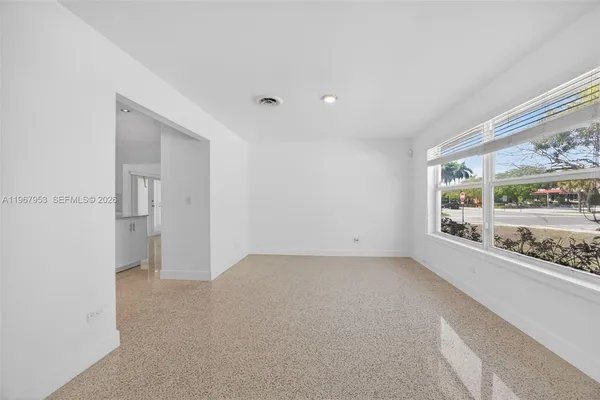 a view of an empty room with a window