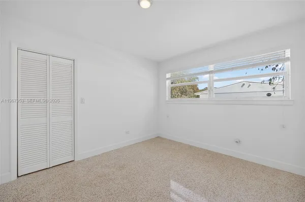 a view of hallway with closet area