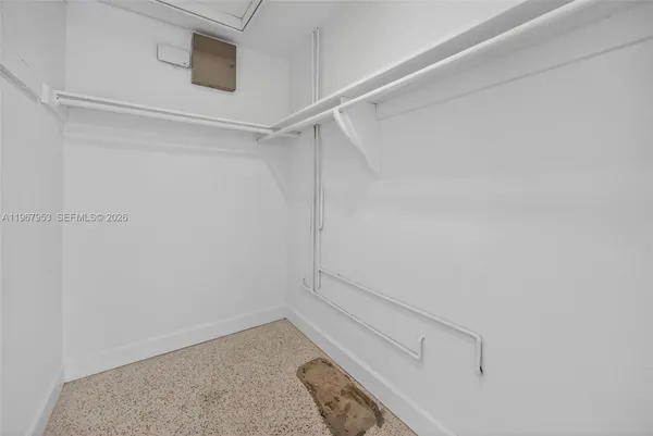 a view of a room that has a table and chairs