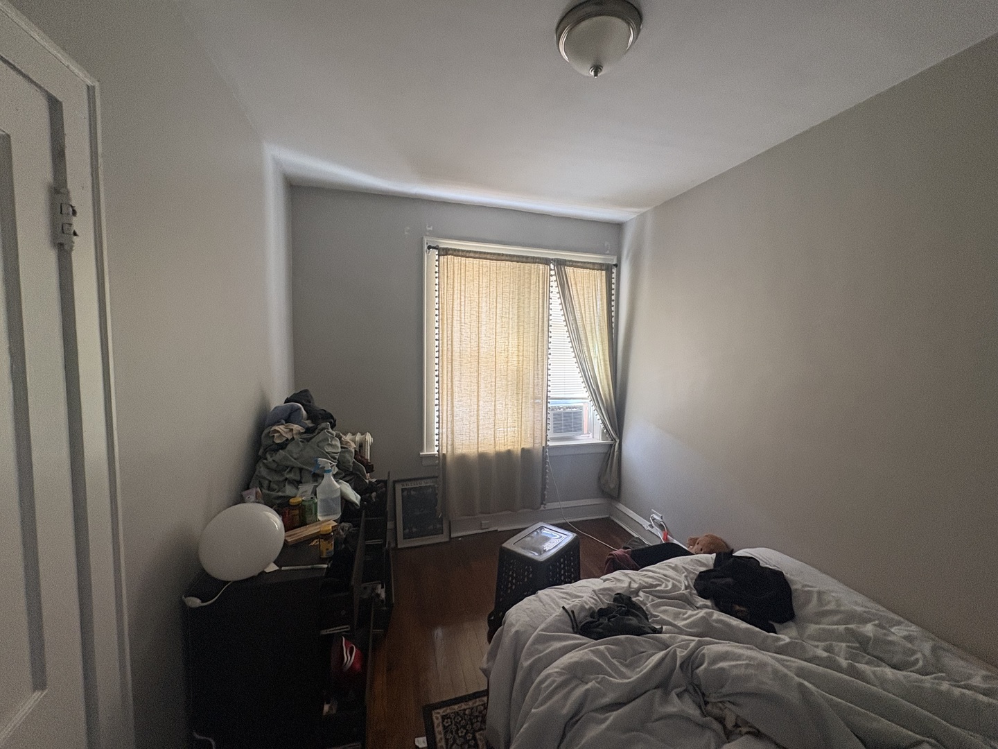 1529 Greenleaf Street Evanston, IL 60202 - Photo 12 of 15 a bedroom with a bed and window