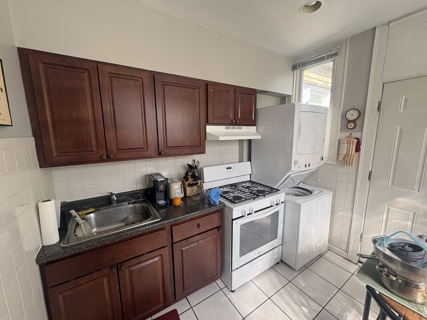 1529 Greenleaf Street Evanston, IL 60202 - Photo 14 of 15 a kitchen with stainless steel appliances granite countertop a stove a sink dishwasher and cabinets with wooden floor