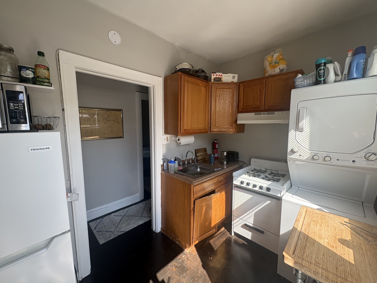 1529 Greenleaf Street Evanston, IL 60202 - Photo 7 of 15 a kitchen with granite countertop a stove and a refrigerator