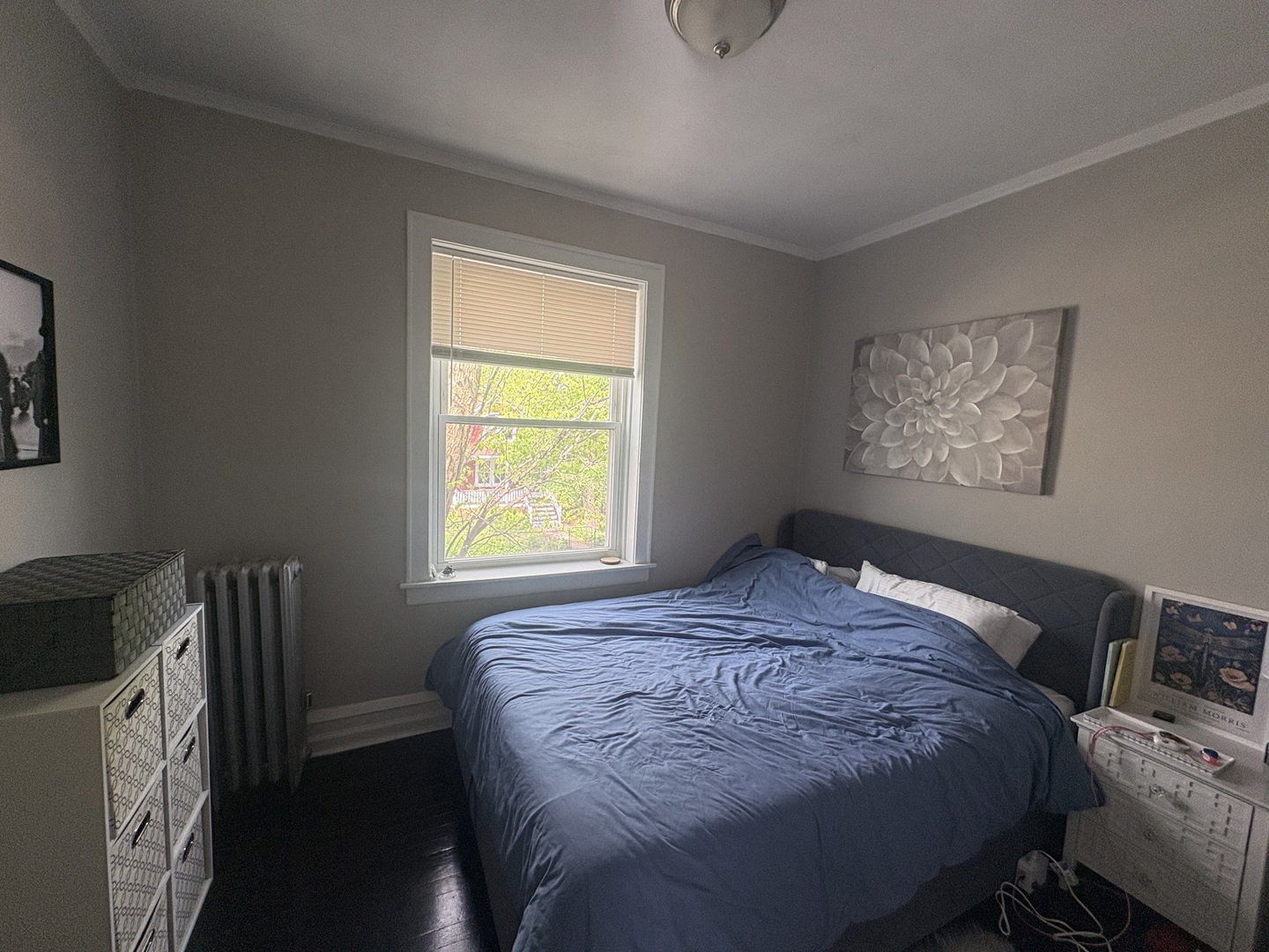 1529 Greenleaf Street Evanston, IL 60202 - Photo 9 of 15 a bedroom with a bed and a window