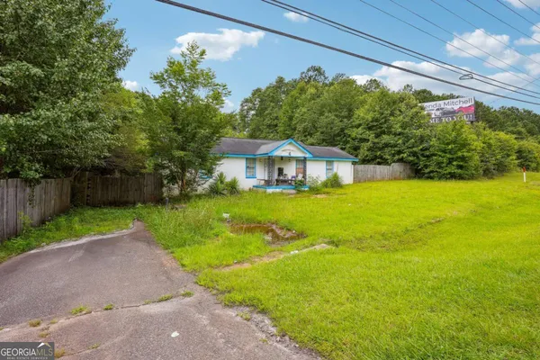a house with garden in front of it