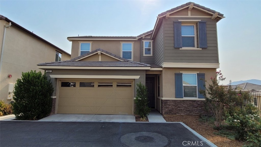 22056 Windham Way Saugus, CA 91350 - Photo 1 of 35 a front view of a house with a yard