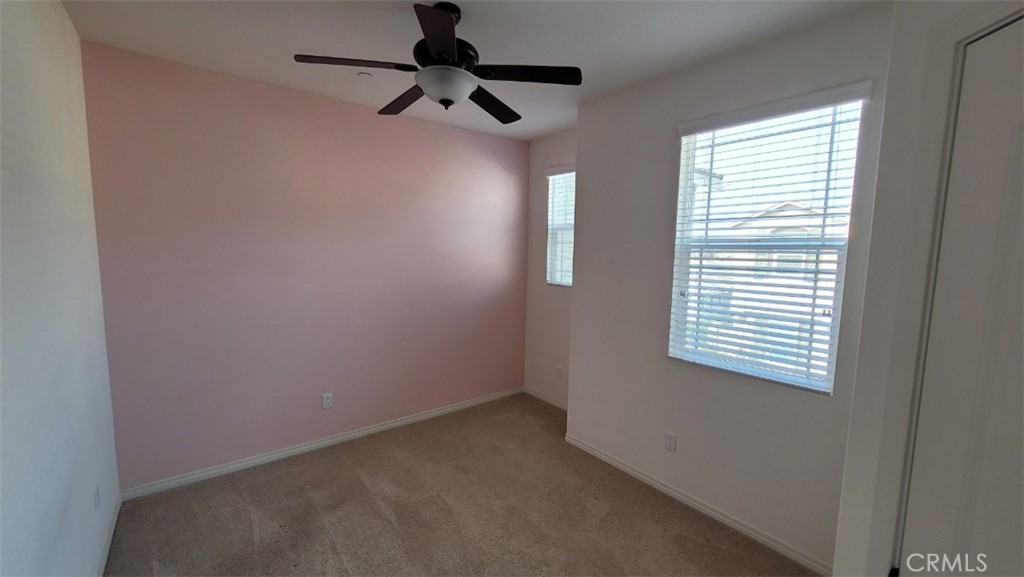 22056 Windham Way Saugus, CA 91350 - Photo 11 of 35 an empty room with a window and a fan