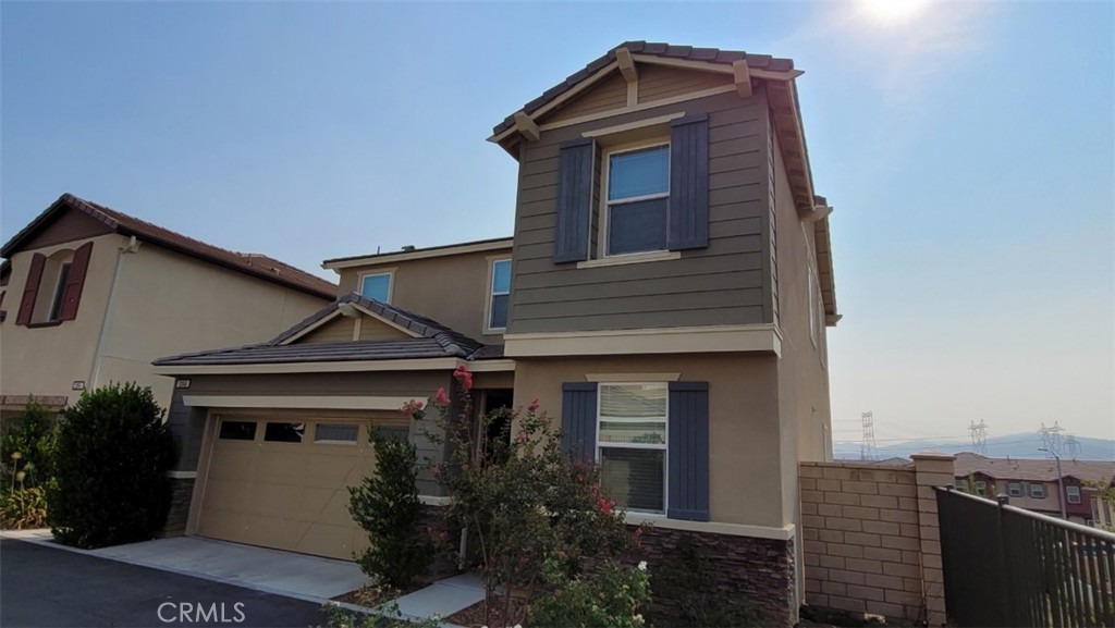 22056 Windham Way Saugus, CA 91350 - Photo 2 of 35 a front view of a house with a yard