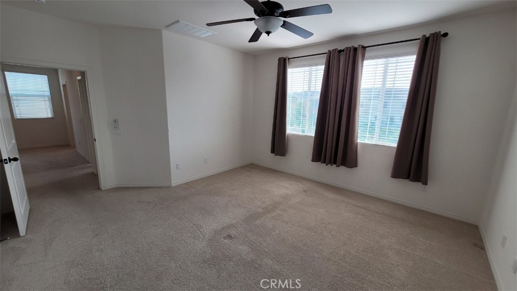 22056 Windham Way Saugus, CA 91350 - Photo 23 of 35 a view of a livingroom with a ceiling fan and window