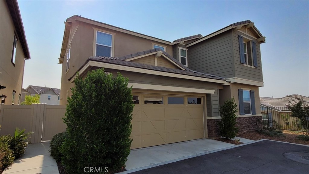 22056 Windham Way Saugus, CA 91350 - Photo 3 of 35 a front view of a house with garden