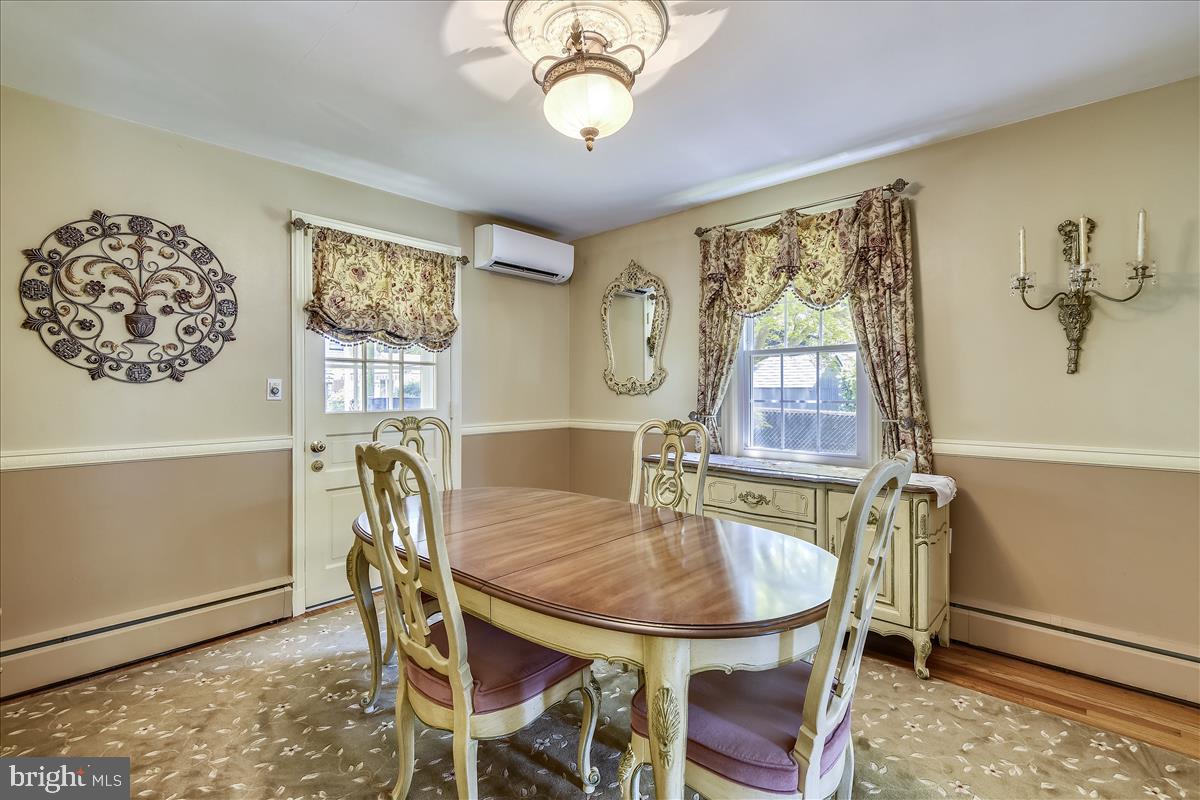 7505 Rocksham Drive Baltimore, MD 21286 - Photo 9 of 24 Dining Room with Chair Rail and Outside Access