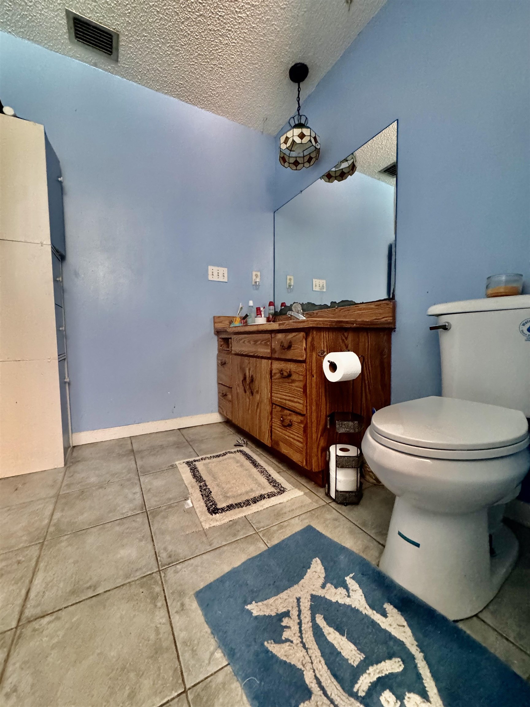 554 Hayley Road St. Augustine, FL 32086 - Photo 25 of 46 a bathroom with a toilet a sink and mirror