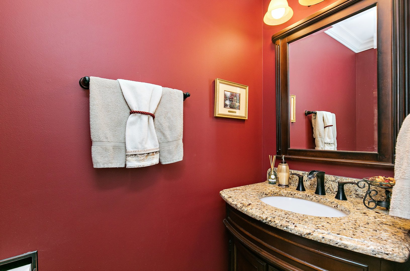 1010 Wakefield Drive Elgin, IL 60120 - Photo 12 of 32 a bathroom with a granite countertop sink a mirror and vanity