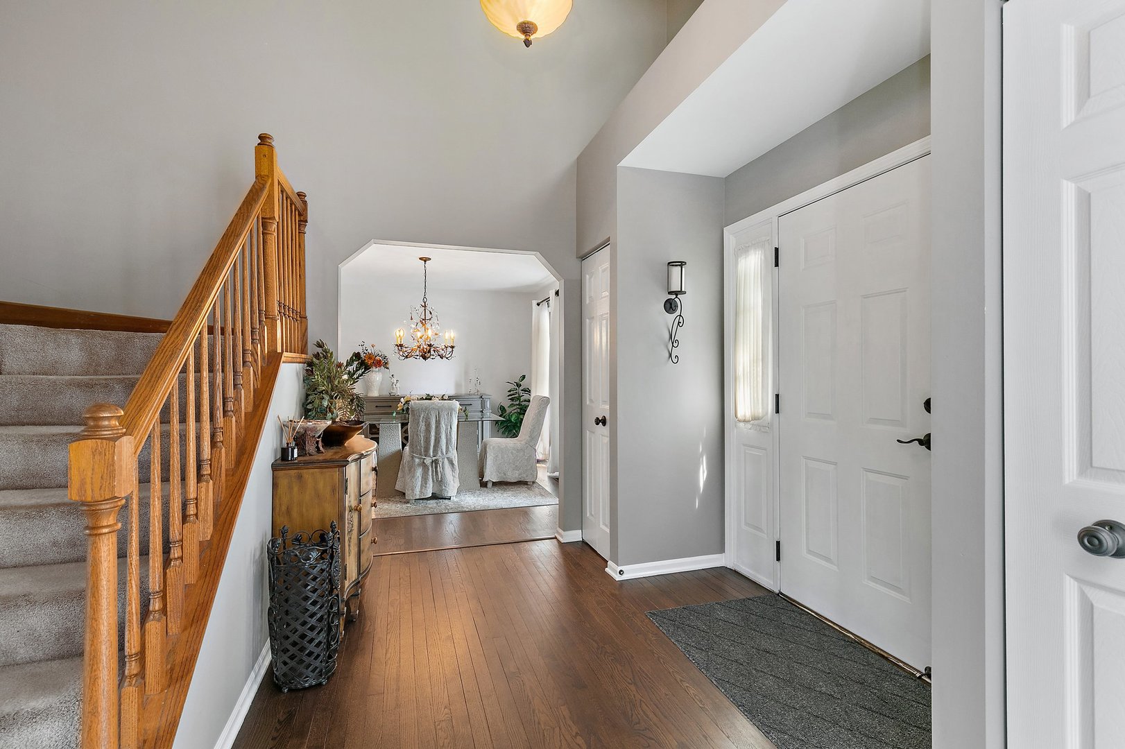 1010 Wakefield Drive Elgin, IL 60120 - Photo 2 of 32 a view of a hallway with wooden floor and stairs
