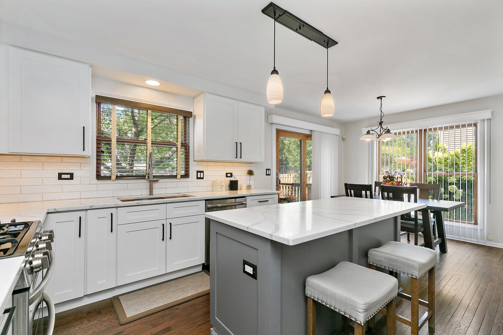 1010 Wakefield Drive Elgin, IL 60120 - Photo 3 of 32 a large kitchen with kitchen island a sink table and chairs